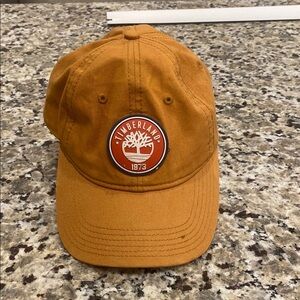 tan-colored Timberland 1973 baseball cap